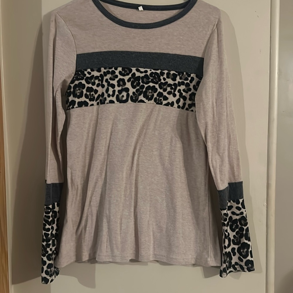 Not sure of the brand, size small tan long sleeve with grey and leopard stripes